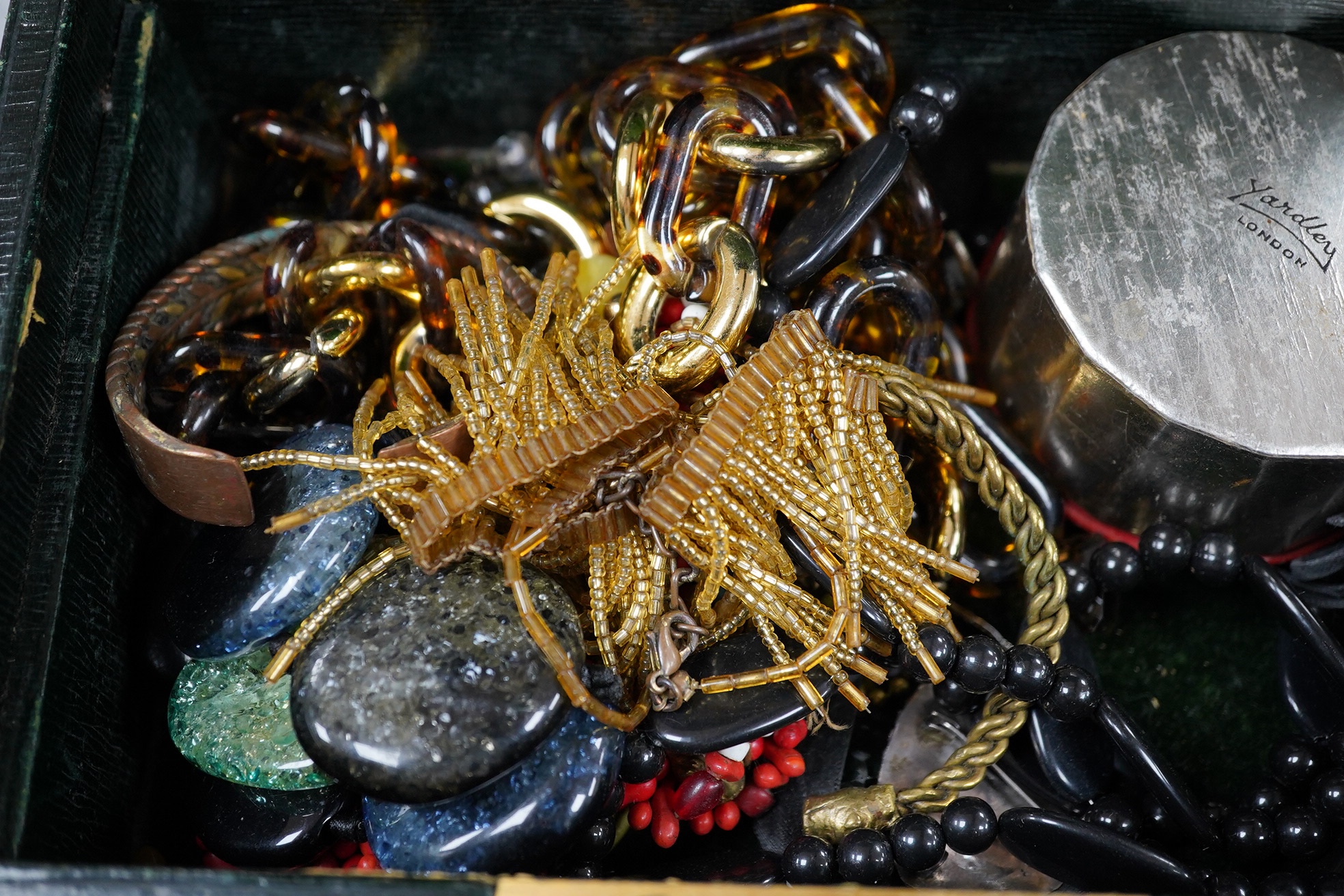 A quantity of assorted mainly costume jewellery in two boxes, including a coral bead necklace. Condition - poor to fair